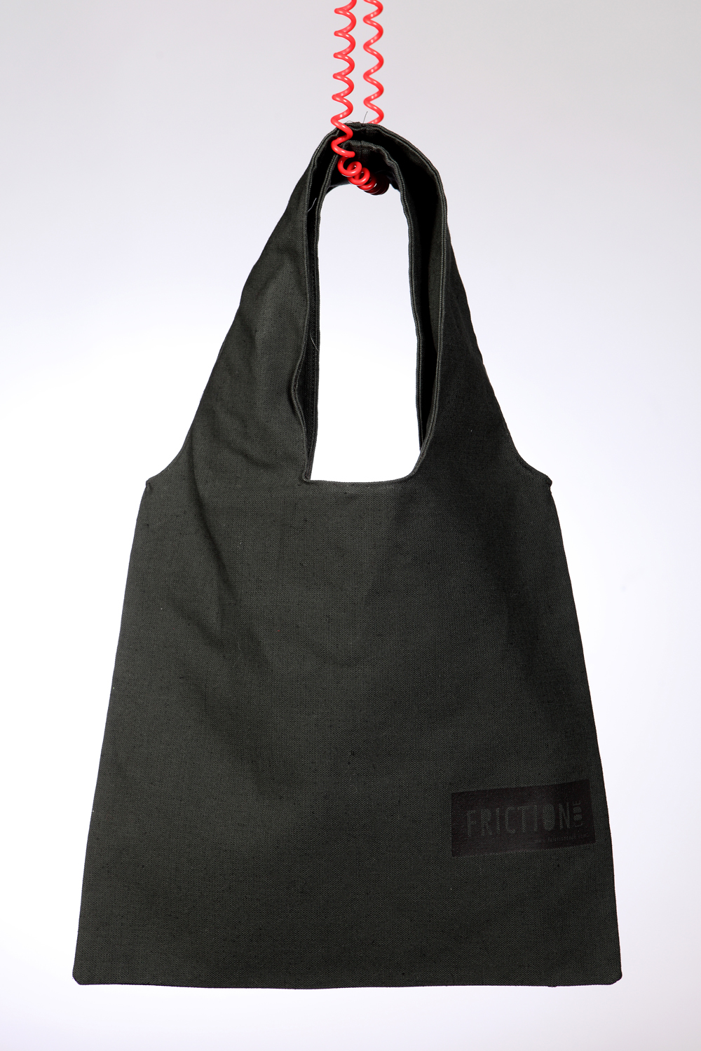 Dark green bag with black label Dark green bag with black label