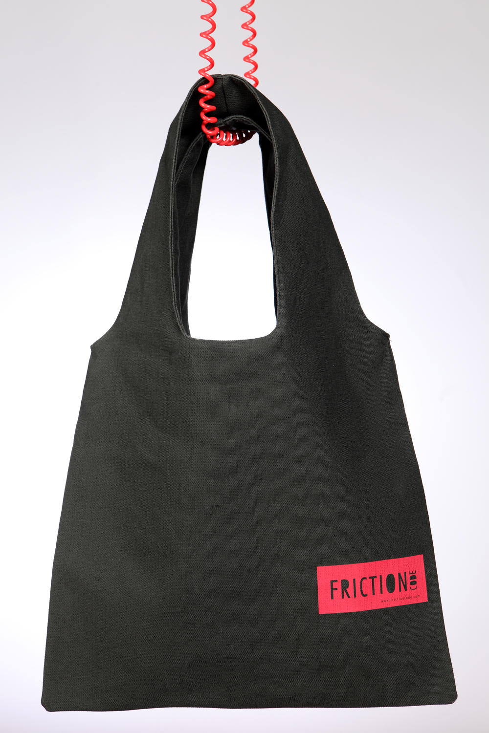 Dark green bag with red label Dark green bag with red label