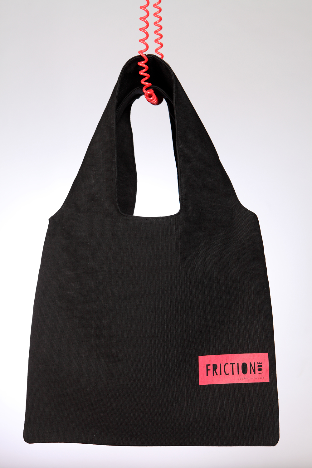 Black bag with red label